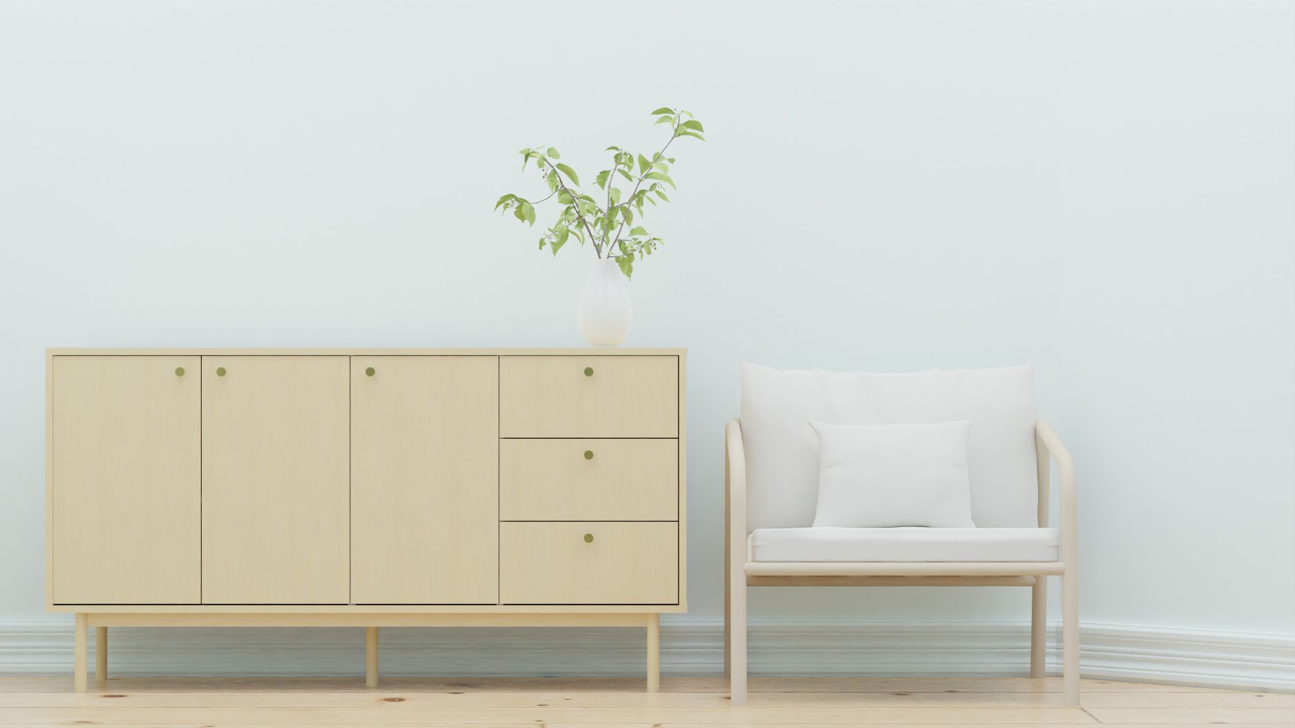 Minimalistyczny salon z drewnianą komodą, fotelem i roślinami